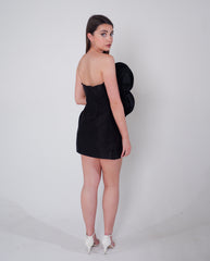 Strapless black satin dress with oversized rose