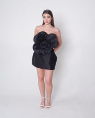 Strapless black satin dress with oversized rose