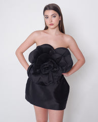 Strapless black satin dress with oversized rose